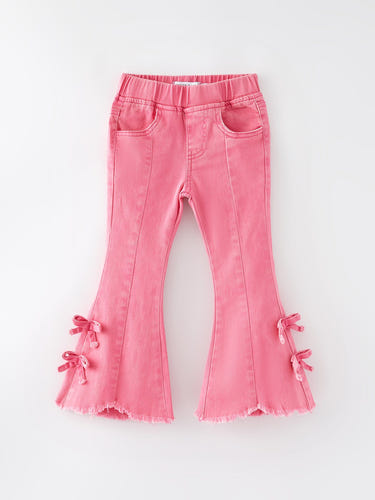 Girls pink bow flared elastic denim pants for stylish and comfortable baby outfits.