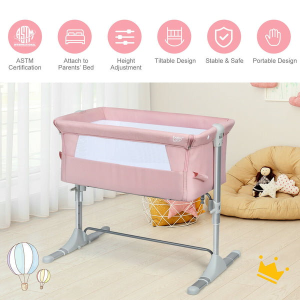 Portable baby bed side sleeper bassinet crib with carrying bag, angled view showcasing its compact design.