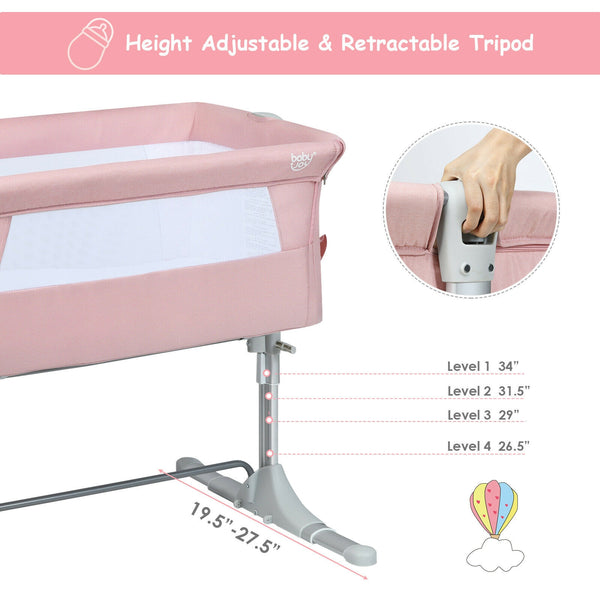 Portable baby bed side sleeper bassinet crib with carrying bag, angled view showcasing its compact design.