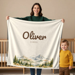 Woodland toddler sherpa blanket in cream, held by a mom
