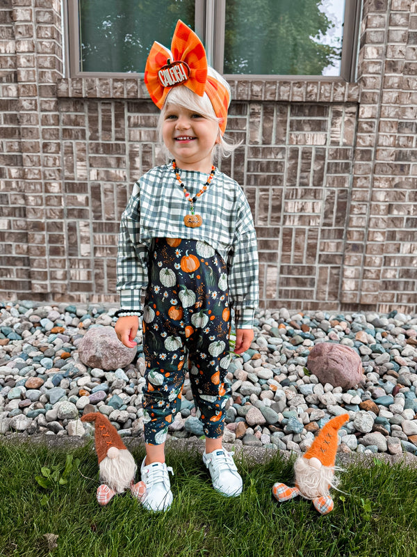 Fall pumpkins honey Ollie romper with snaps, perfect for stylish baby outfits. Angle 3 view showcasing design details.