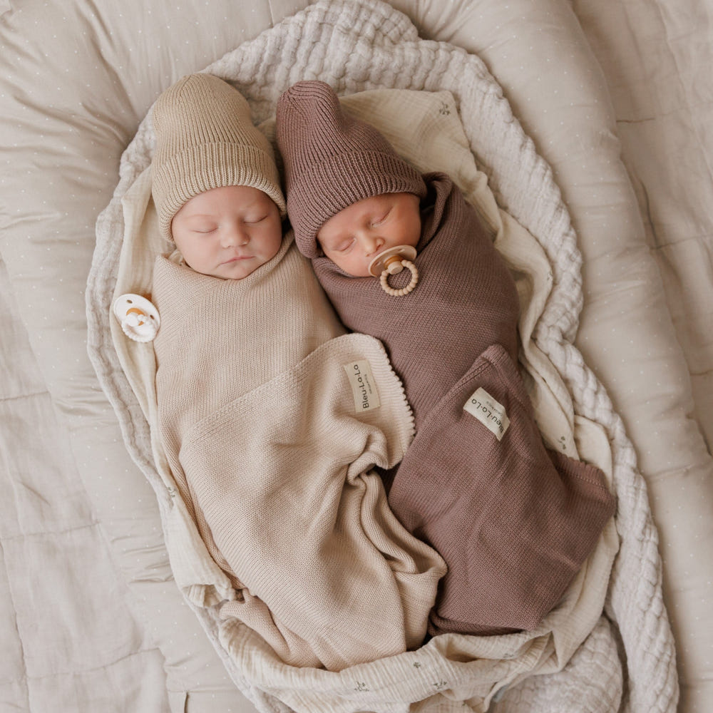 Luxe Collection organic cotton baby blanket and hat set in gift box, perfect for cozy comfort and stylish gifting.