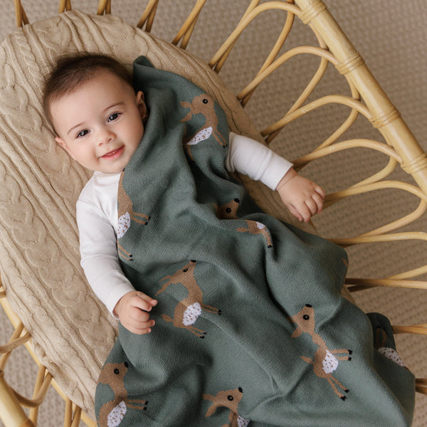 Luxury cotton deer knit swaddle baby blanket in soft, cozy design, perfect for keeping your little one warm and snug.