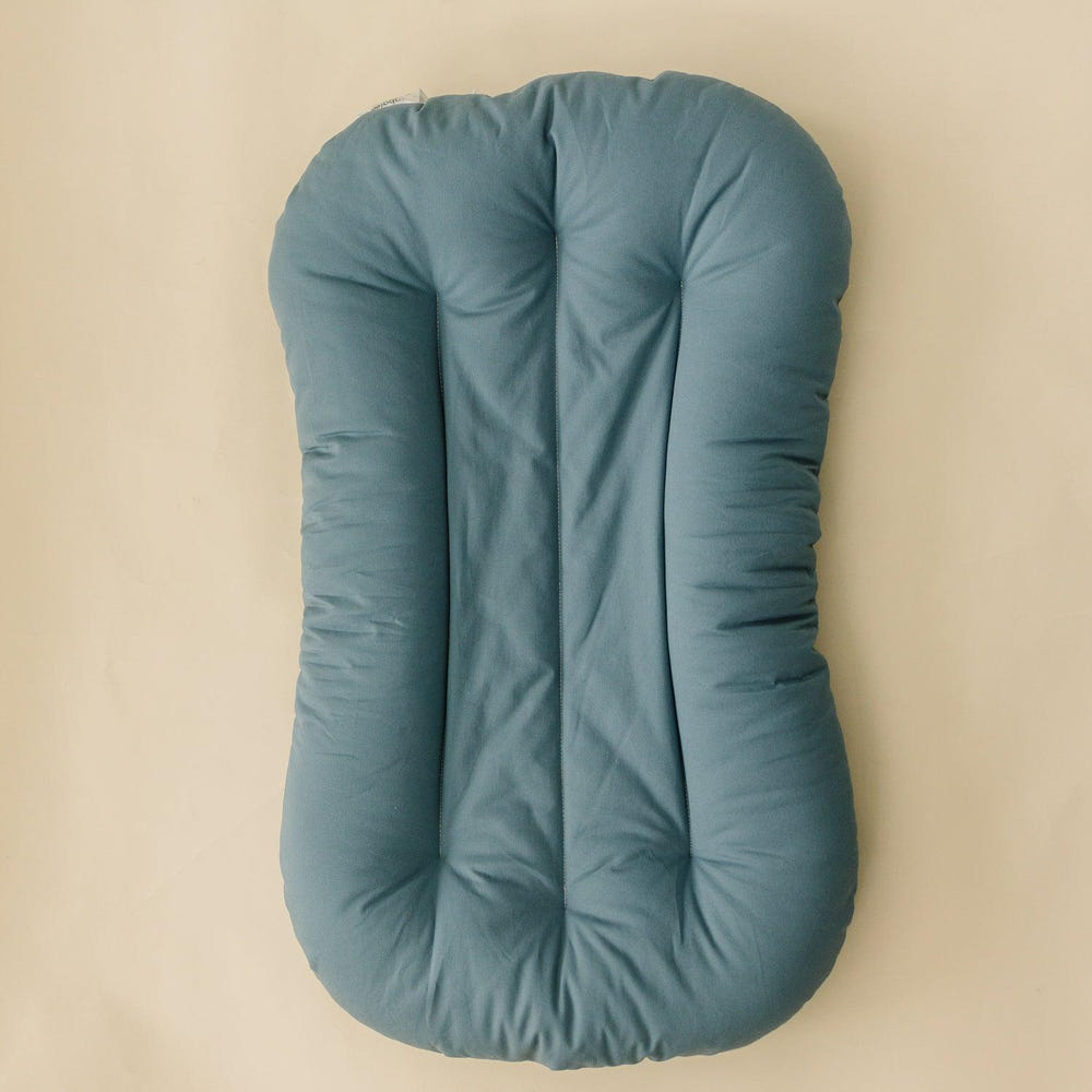 Infant Lounger Pillow in Bluejay - Comfortable travel essential for babies, perfect for lounging and support.