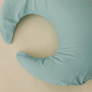 Nursing pillow cover in eucalyptus design, perfect for comfortable breastfeeding support.