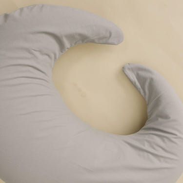 Nursing pillow cover in stone color, perfect for comfortable breastfeeding support.