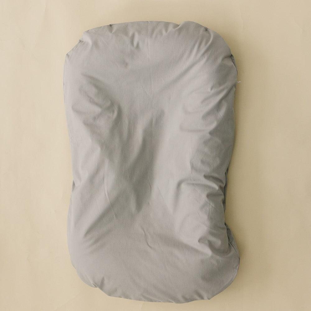 Stone infant lounger cover for cozy and stylish baby comfort. Perfect accessory for your little one's lounging needs.