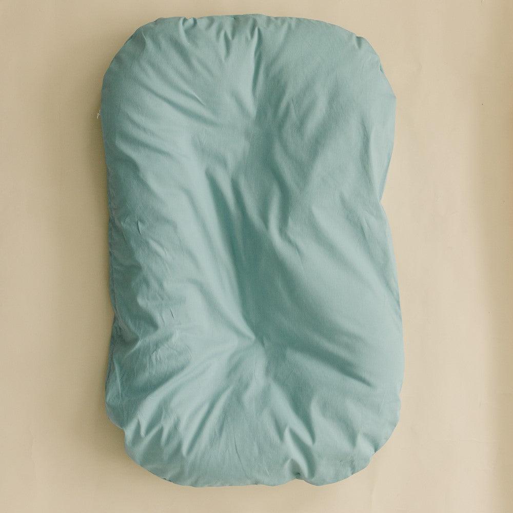 Infant lounger covers in eucalyptus design, perfect accessory for baby comfort and style.
