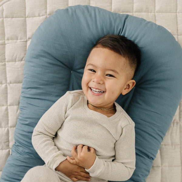 Toddler Lounger Pillow in Bluejay color for comfortable sleep and playtime, perfect for bedding and relaxation.