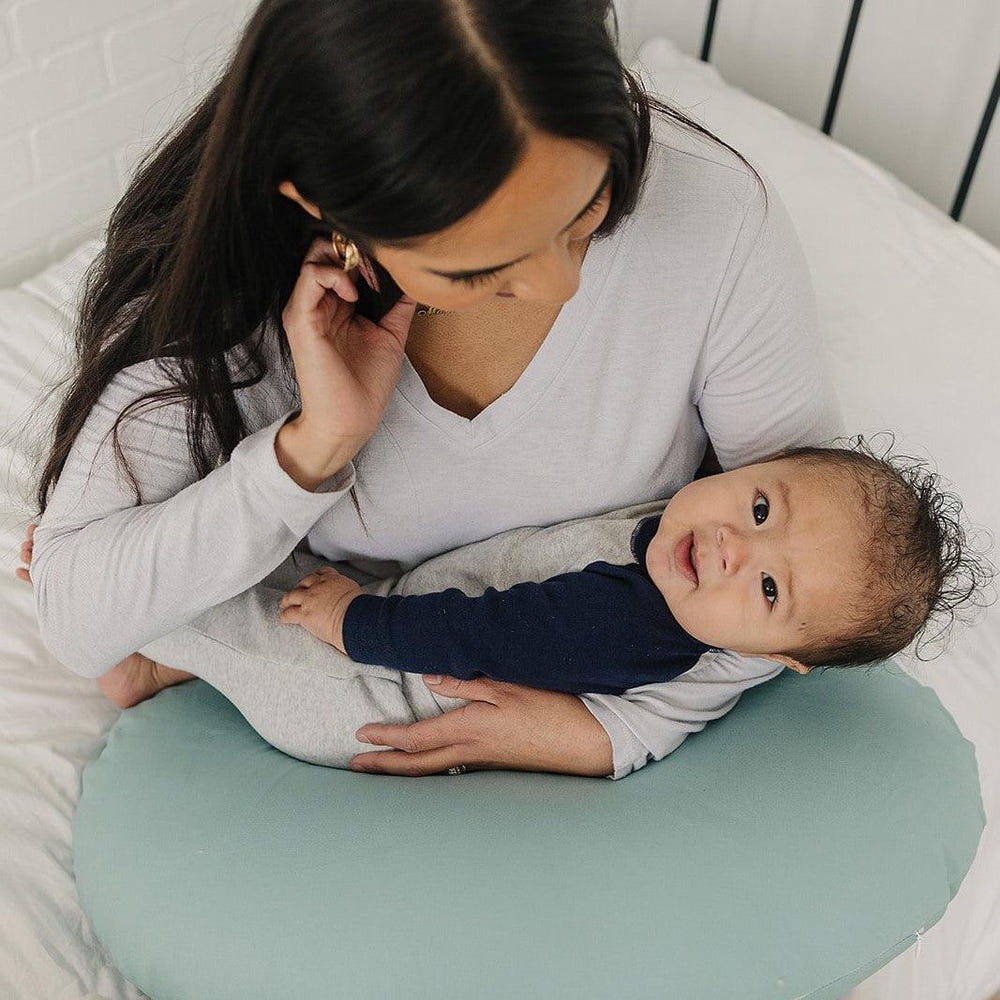 Nursing pillow cover in eucalyptus design, perfect for comfortable breastfeeding support.