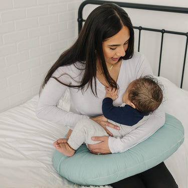 Eucalyptus nursing pillow for comfortable breastfeeding support and relaxation for moms and babies.