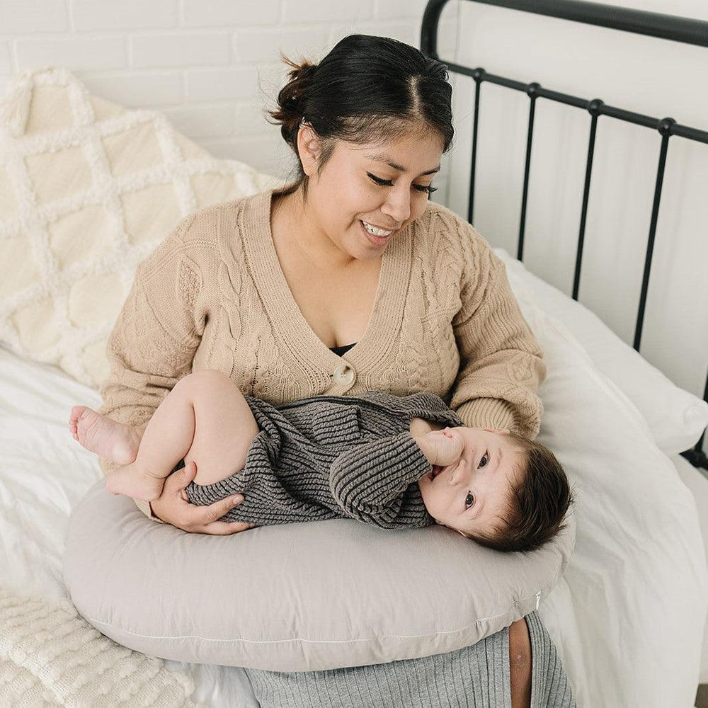 Nursing pillow cover in stone color, perfect for comfortable breastfeeding support.