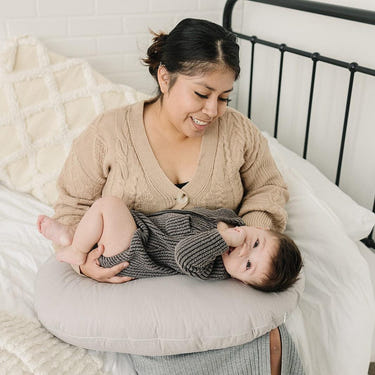Stone nursing pillow for comfortable breastfeeding support, designed for moms and babies.