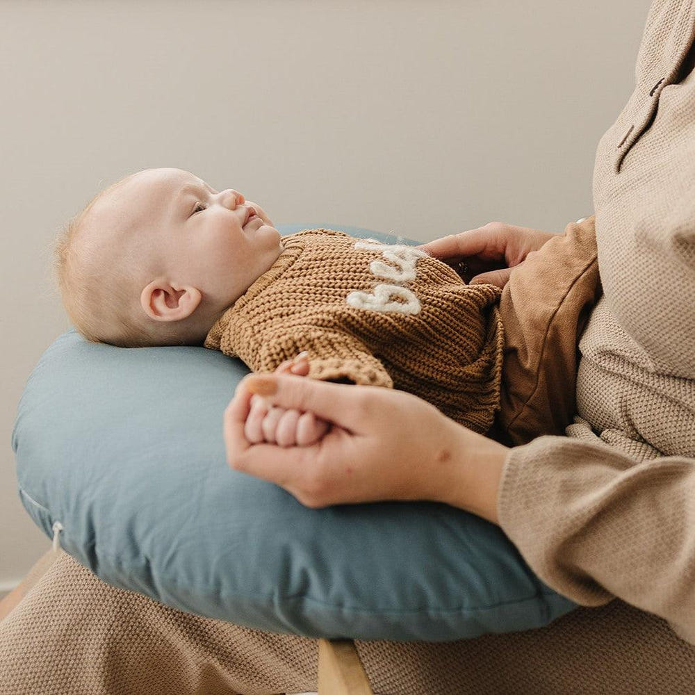 Bluejay Nursing Pillow for comfortable breastfeeding support, featuring a soft, ergonomic design in a soothing blue color.