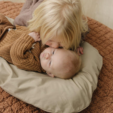 Infant lounger cover in fawn color, perfect accessory for baby comfort and style.