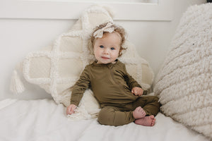 Solid Bamboo Zippy Pajamas in various colors, angle view 4, perfect for cozy baby sleepwear.