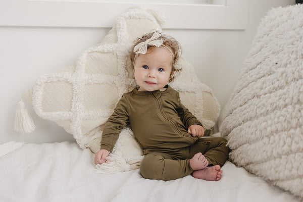 Solid Bamboo Zippy Pajamas in various colors, angle view 4, perfect for cozy baby sleepwear.