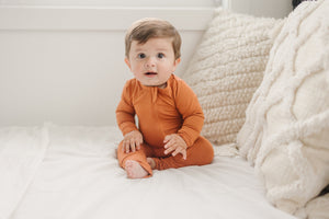 Solid Bamboo Zippy Pajamas in various colors, angle view 6, perfect for cozy baby sleepwear.
