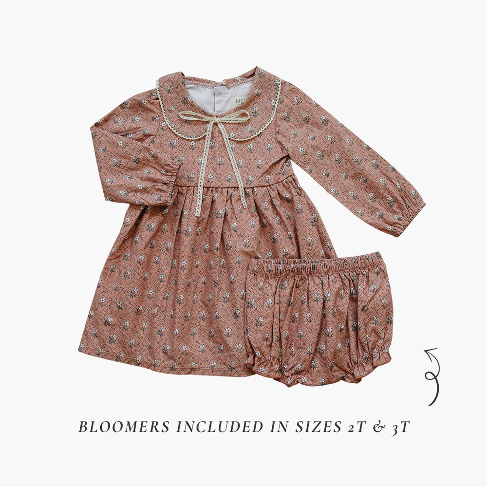 Vintage pink floral dress for babies, perfect for special occasions and everyday wear.