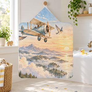 Birds and Biplane kids hooded bath towel hanging in a kids bathroom