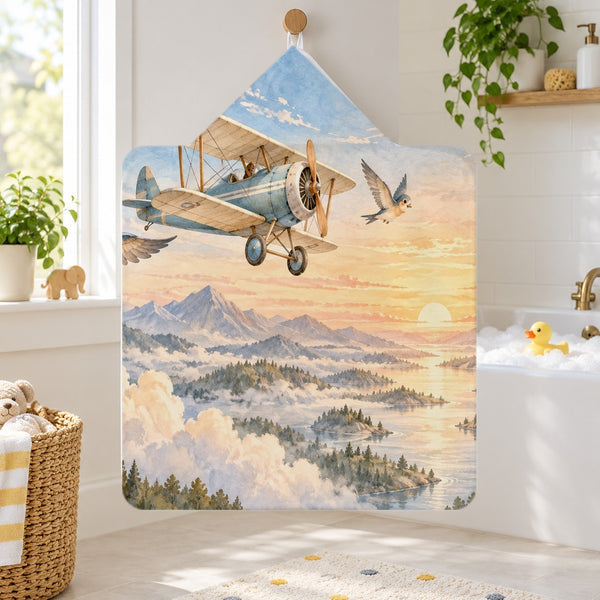 Birds and Biplane kids hooded bath towel hanging in a kids bathroom