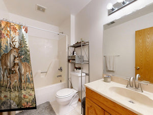 Deer Teepee Camping shower curtain on a tub shower combo in an American family bathroom