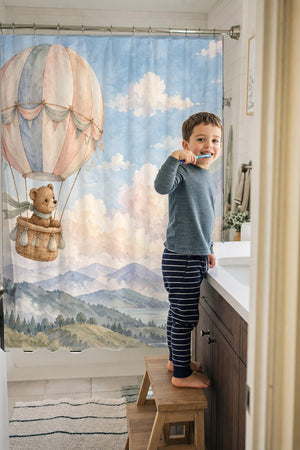 Child brushing teeth in a family bathroom with the Bear Hot Air Balloon shower curtain