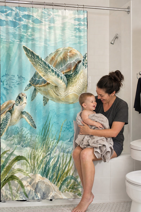 Mom holding her baby on the tub edge next to the Sea Turtles Ocean shower curtain