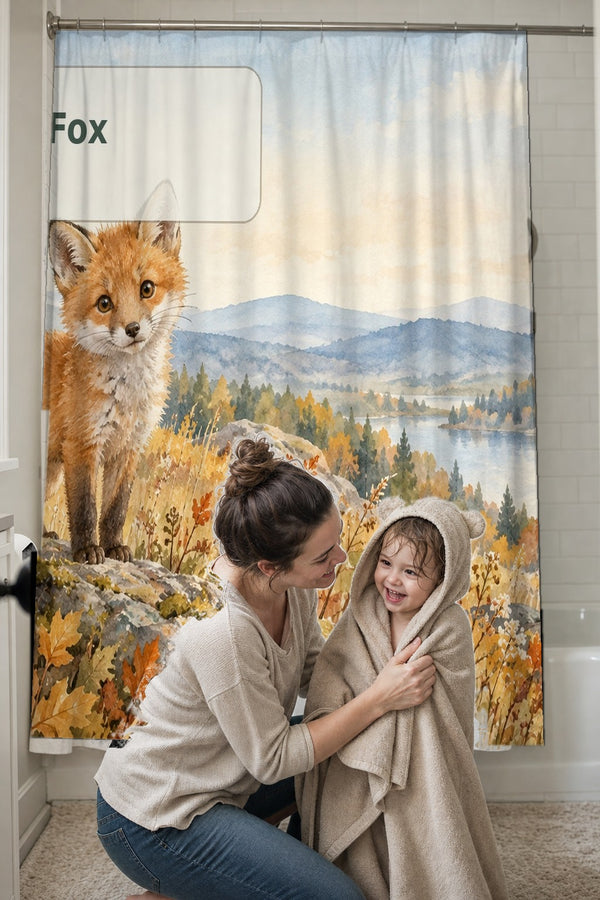 Mom drying her toddler in a hooded towel in front of the F is for Fox Alphabet shower curtain
