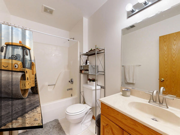 Road Roller shower curtain on a tub shower combo in an American family bathroom