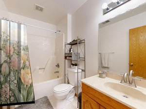Pastel Tulip Field shower curtain on a tub shower combo in an American family bathroom