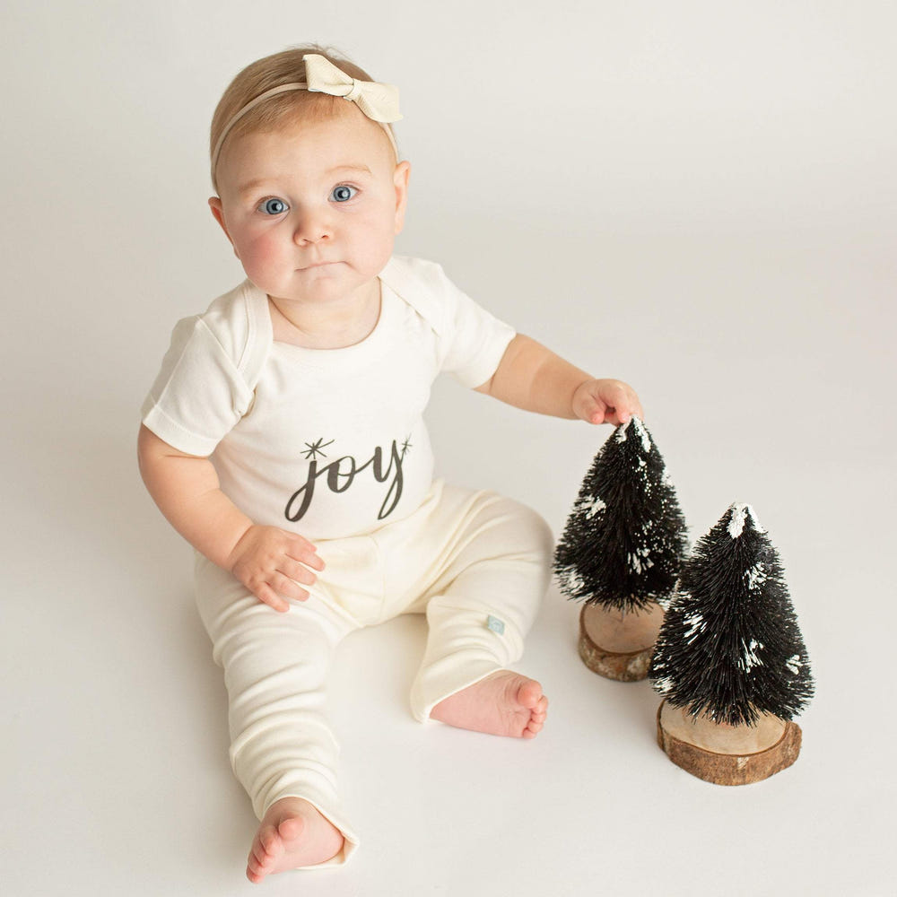 Joy Black Graphic Bodysuit for babies - stylish short sleeve design, perfect for comfort and play.