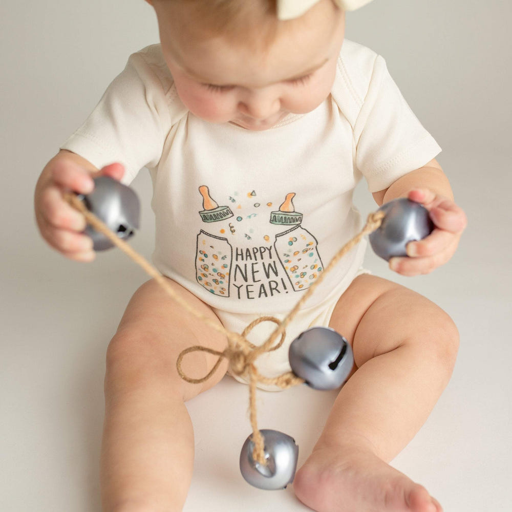 Short sleeve graphic bodysuit for babies featuring "Poppin Bottles" design. Perfect for playful and stylish outfits.