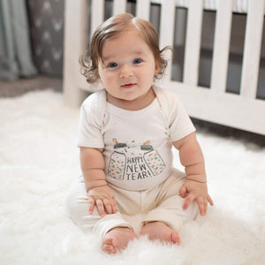 Graphic bodysuit "Poppin Bottles" in angle view, perfect short sleeve onesie for stylish babies.