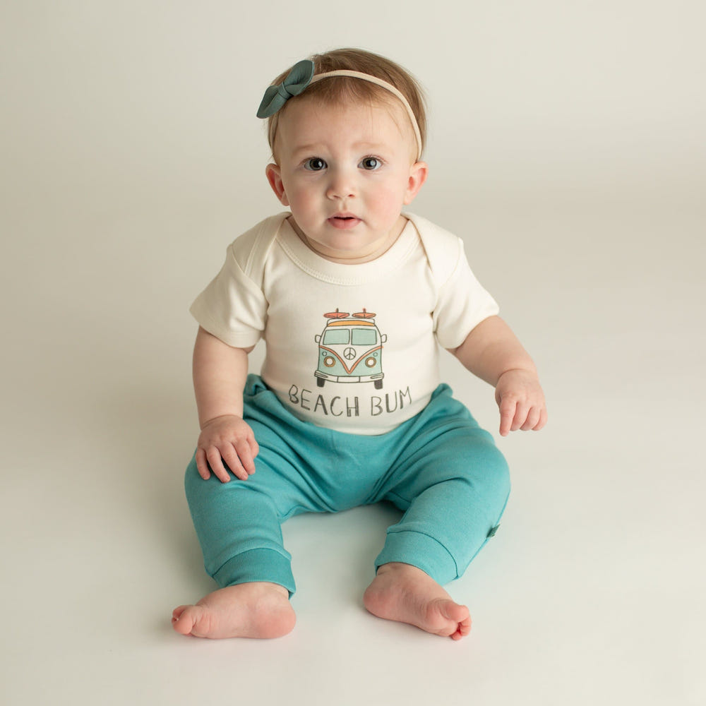 "Graphic bodysuit for babies, 'Beach Bum' design, perfect for summer fun in short sleeves."