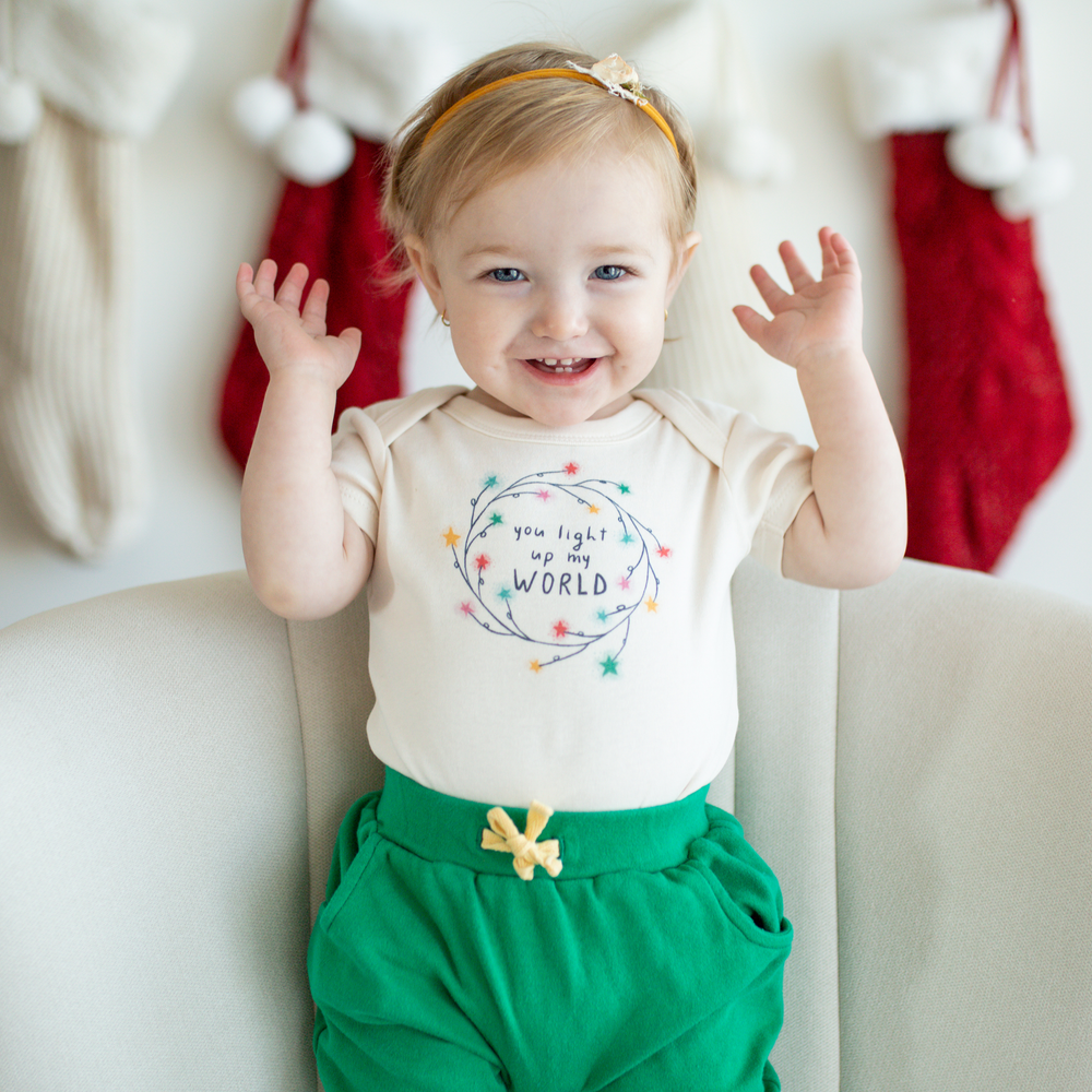 Light Up My World graphic bodysuit for babies, short sleeve design, perfect for playful and stylish outfits.
