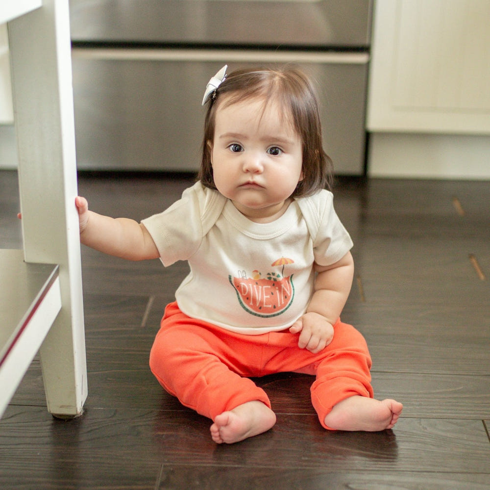 Graphic bodysuit "Dive In" for babies, featuring a fun design in a short sleeve style. Perfect for playtime!