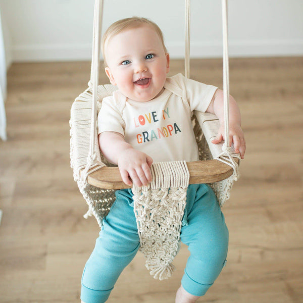 Graphic short sleeve bodysuit for babies featuring "Love Grandpa" design, shown from angle 2.