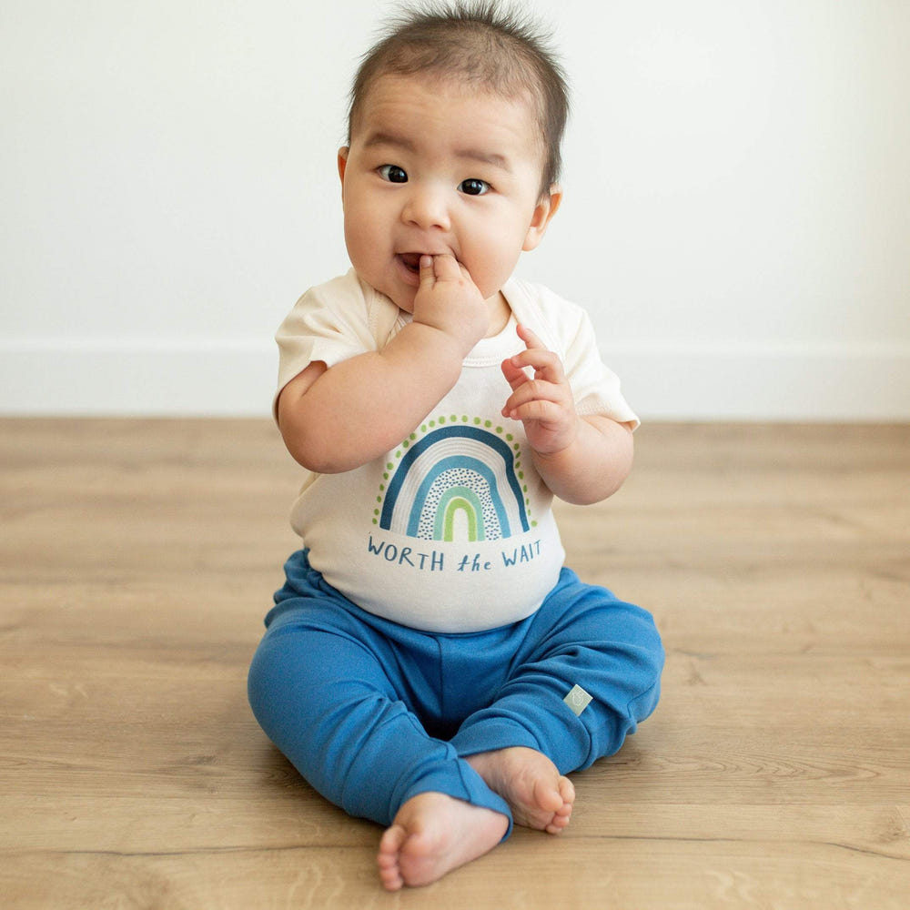 "Graphic bodysuit 'Worth the Wait' for babies - stylish short sleeve design."