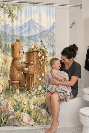 Mom holding her baby on the tub edge next to the Bear Piano shower curtain