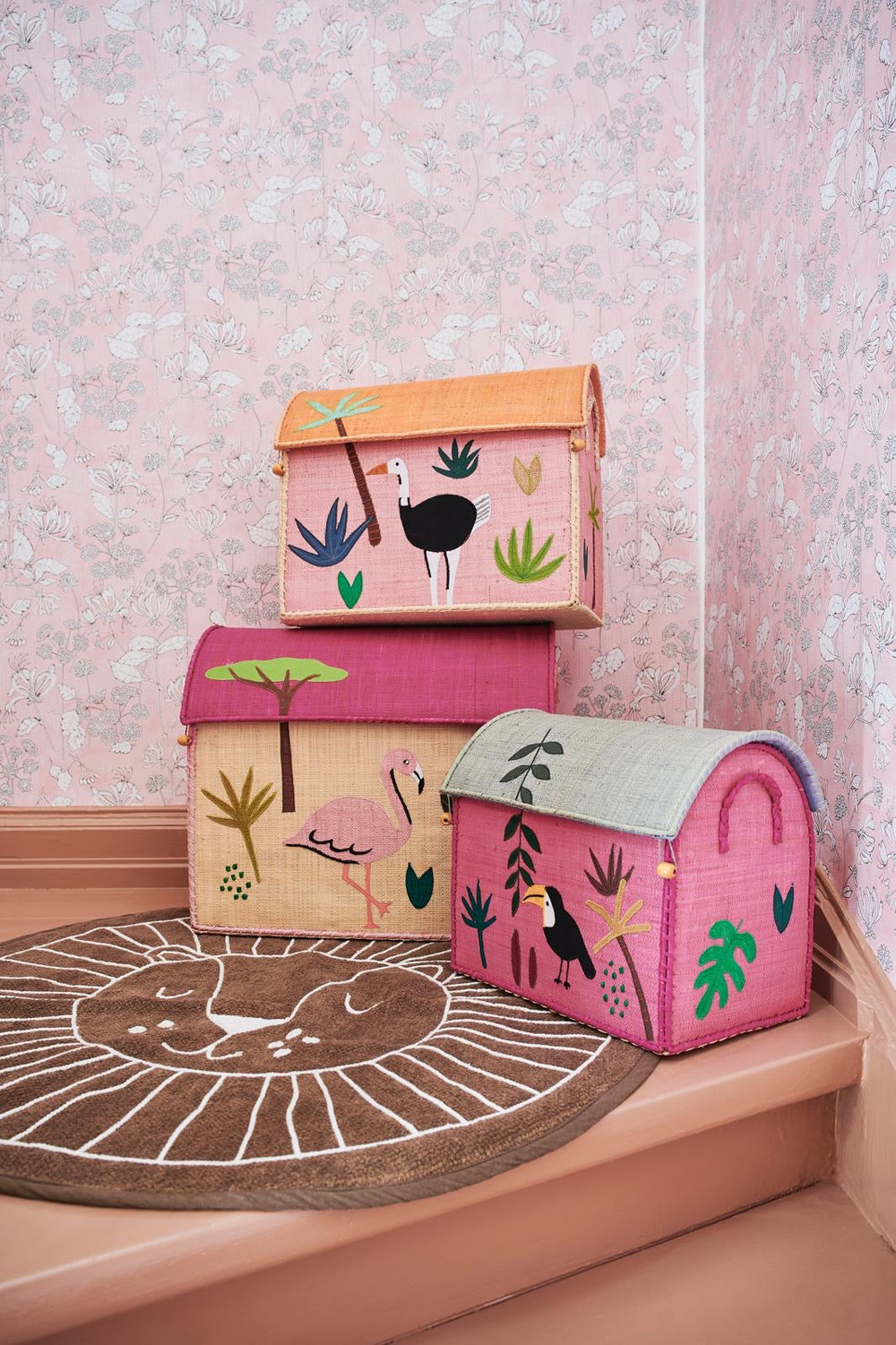 Set of three jungle pink raffia storage baskets for toys, perfect for organizing and enhancing nursery decor.