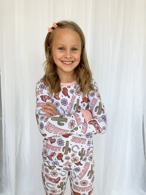 Howdy Darling Set sleepsuit and pyjamas for babies, shown from angle 4, featuring soft fabric and adorable design.