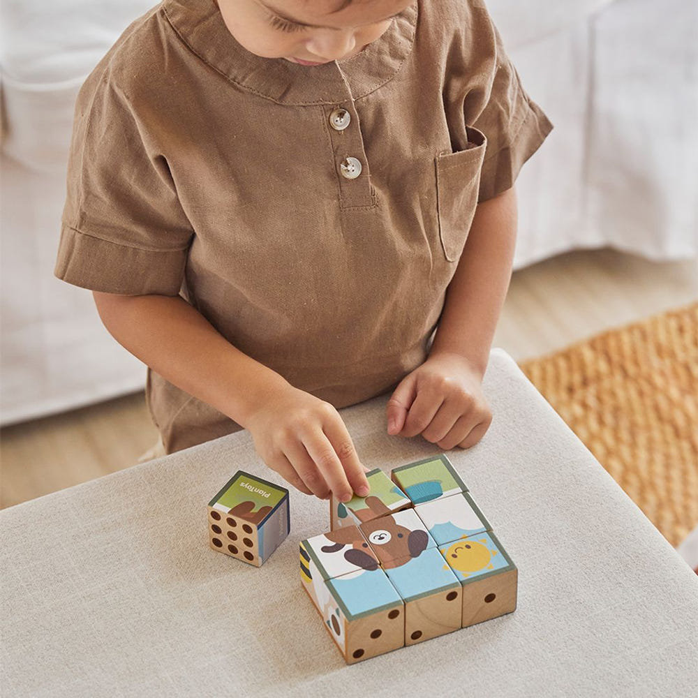 Colorful animal puzzle cubes for babies, promoting creativity and fine motor skills in playtime activities.