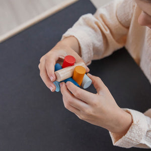Log Puzzle - PlanMini furniture for babies, showcasing a colorful wooden design from angle 2.