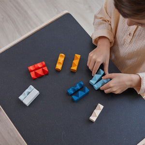 Colorful Log Puzzle by PlanMini, showcasing unique design and playful angles for baby furniture.