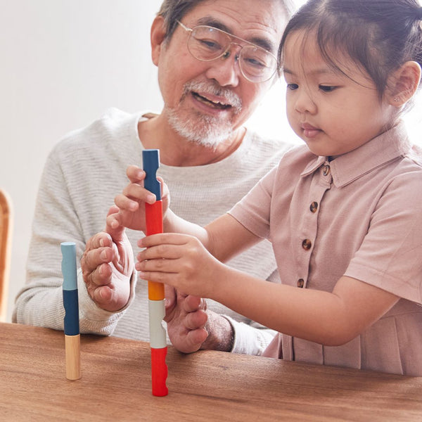 Colorful Log Puzzle from PlanMini, designed for babies, showcasing furniture for playful learning at angle 5.