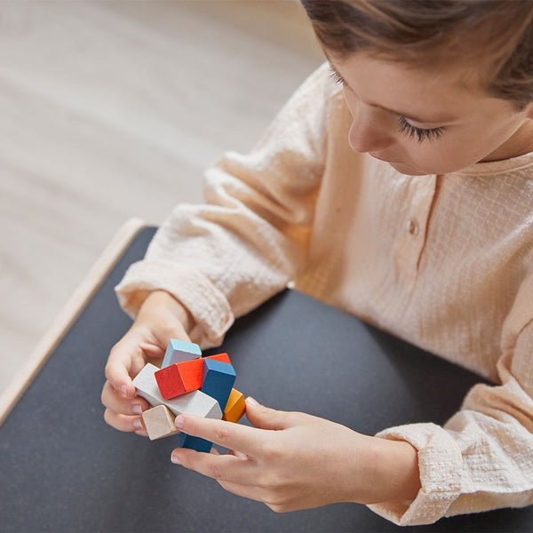 Rectangular PlanMini puzzle for babies, showcasing colorful design and safe, durable materials from an angled view.