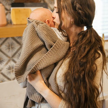 Pewter knitted swaddle blanket for babies, soft and cozy for comfortable wrapping.