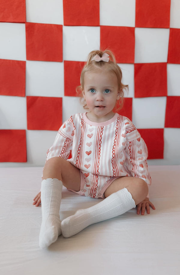 Laced with Love Sweatshirt Romper for babies, stylish and cozy, shown from angle 4. Perfect for playful outings.