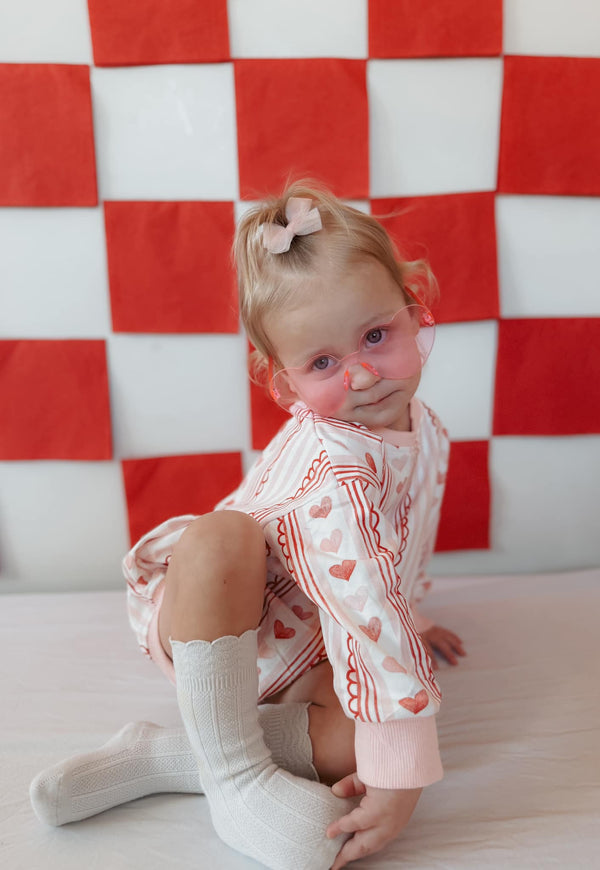 Laced with Love Sweatshirt Romper for babies, stylish and cozy outfit in a trendy design.